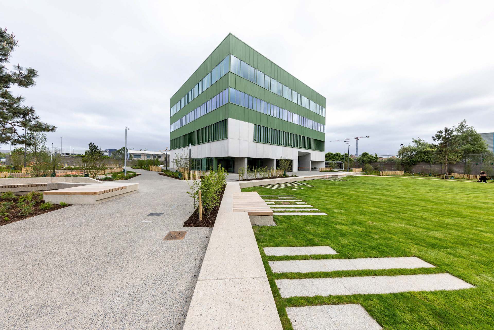 Modern green-clad civic building within landscaped public space in South Dublin County